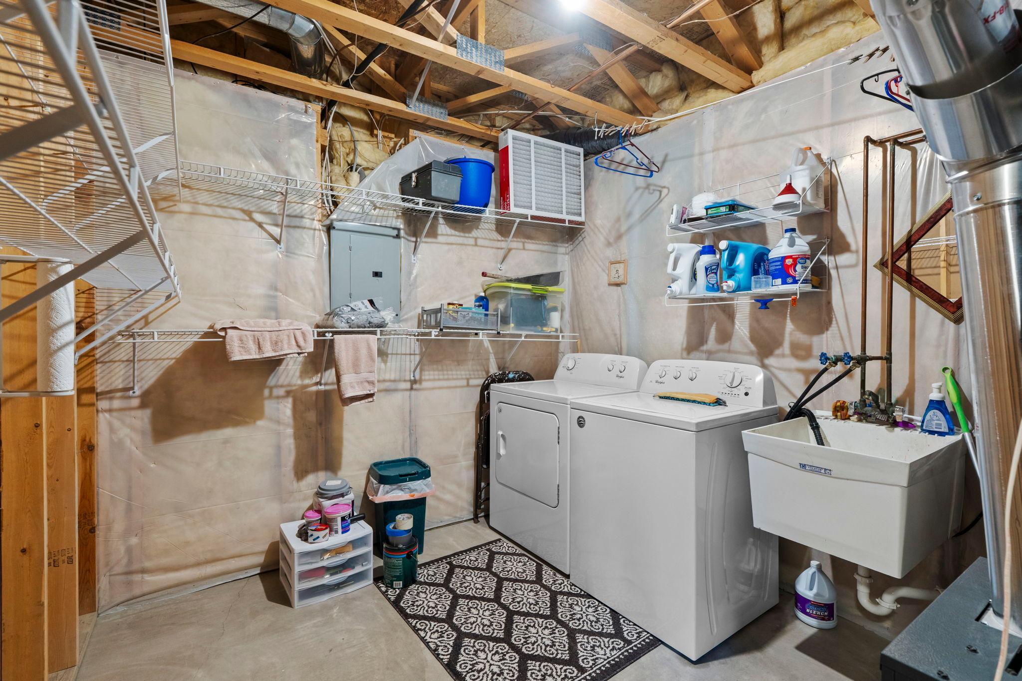 Laundry is in utility room with wash sink