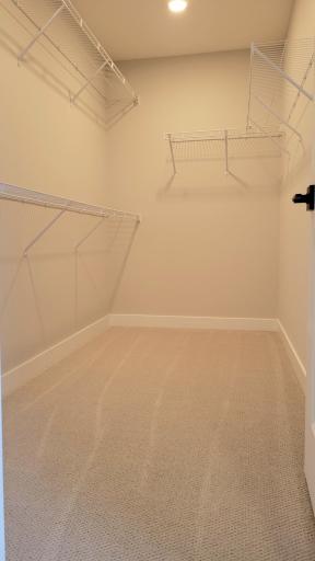 This generous owner's dressing room is sure to house all of your favorite wardrobe pieces.