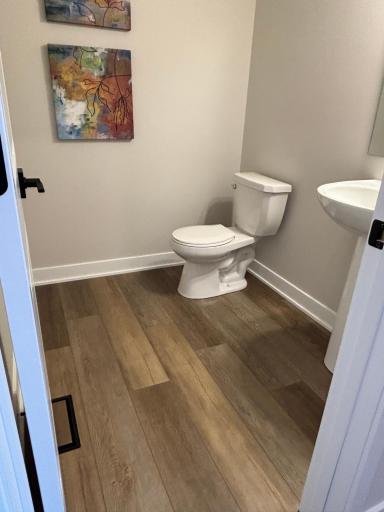 Generously sized Power Room off of the Mud Room offers privacy and convenience for your entire crowd.