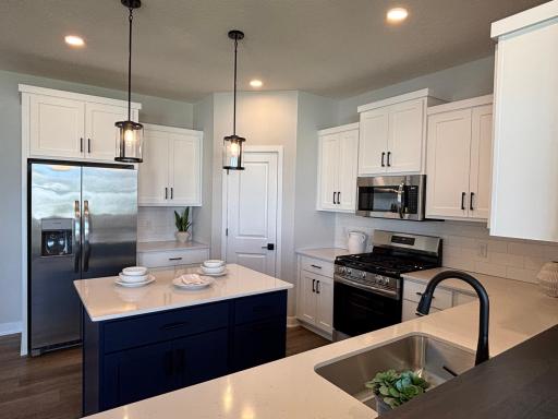 Thoughtfully designed kitchen with premium finishes and extensive cabinet storage space.