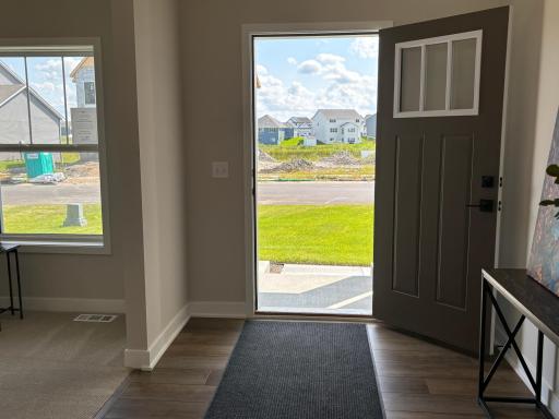 Welcome your friends and family into this spacious and functional foyer designed for warm, friendly greetings!