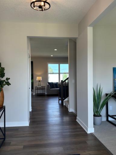 Beautiful Luxury Vinyl Plank Flooring on the main level creates a seamless flow throughout.