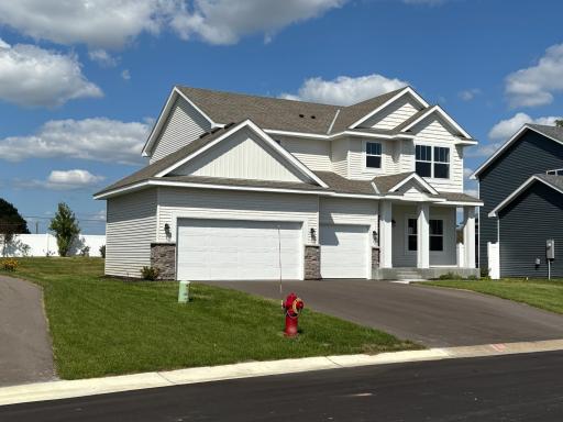 Spacious side lot presence with professionally maintained landscaping including an in-ground lawn irrigation system.