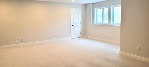 Expansive lower-level layout offers incredible flexibility for modern living and offers generous natural west-facing lighting.