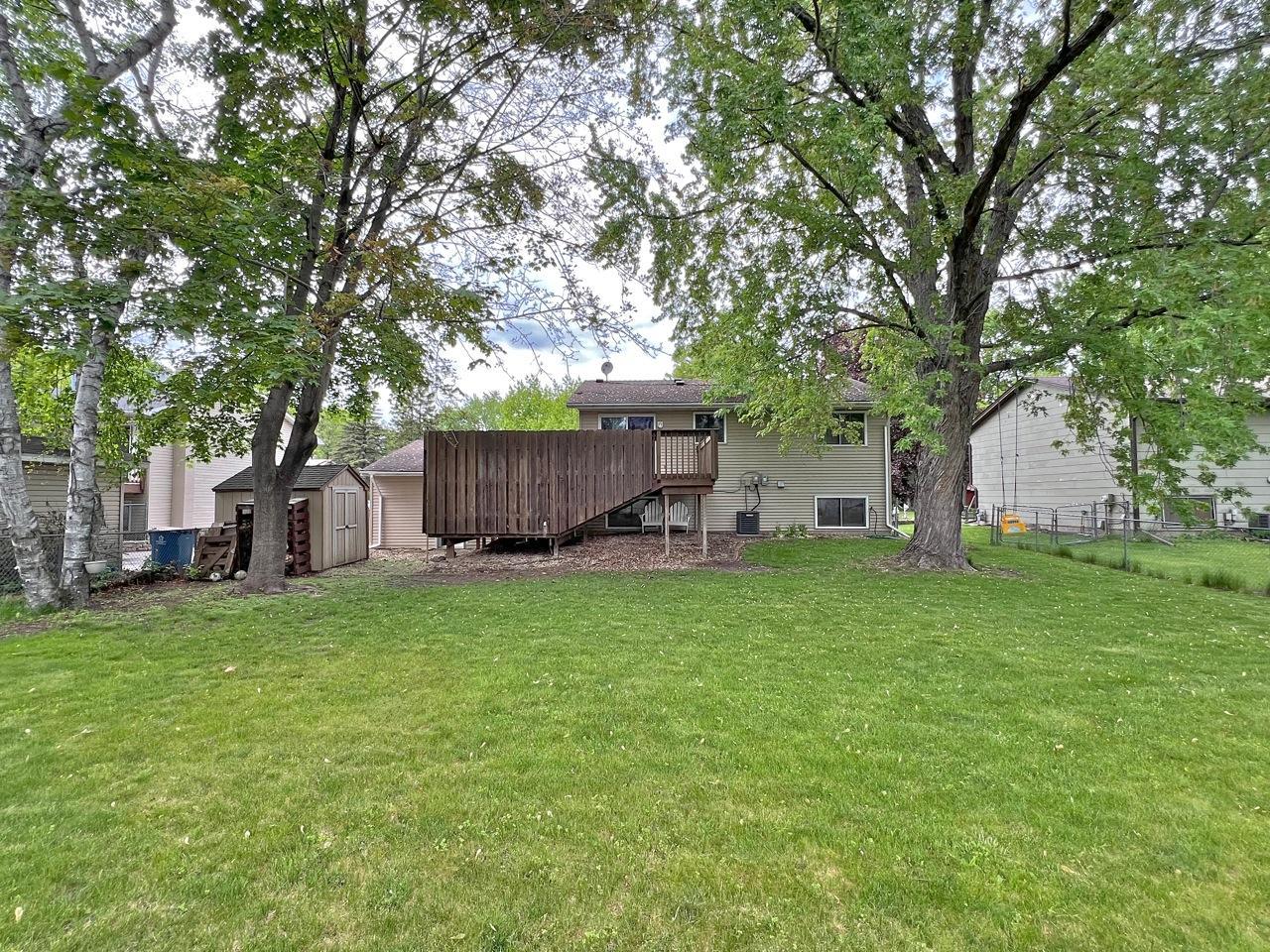 Huge backyard! This image includes the enclosed deck & convenient shed