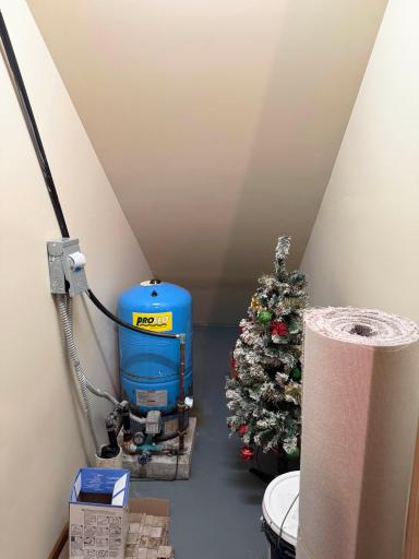 A look at the storage space under the stairs in the utility room.