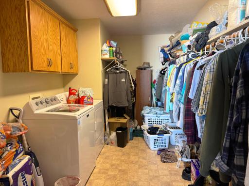 A peek into this massive laundry room-closet, located inside the walk-in closet in the primary bedroom.