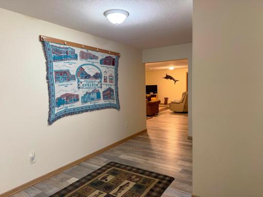Looking towards the lower level family room from the hallway at the base of the stairs.
