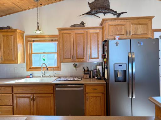 A closer look at the kitchen appliances and cabinetry.