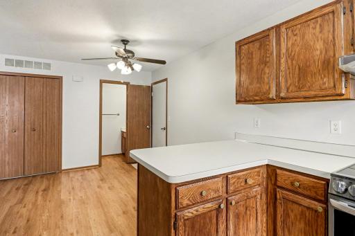 View towards garage, informal dining and powder room