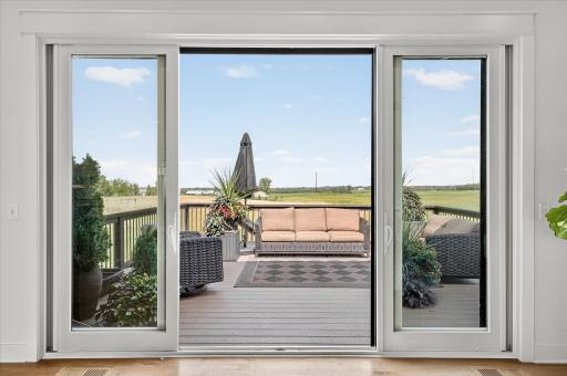 Sliding glass doors open to the back deck, creating seamless indoor-outdoor living.