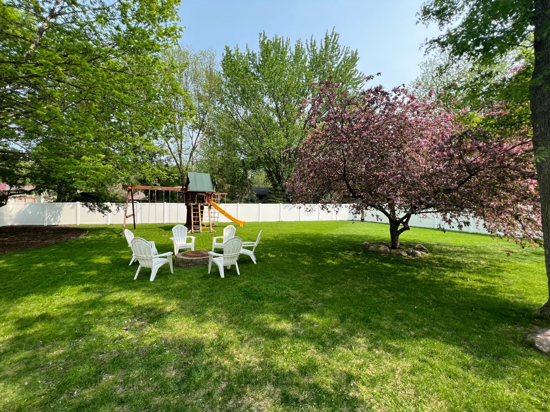 Imagine summer nights in this huge fenced in backyard!