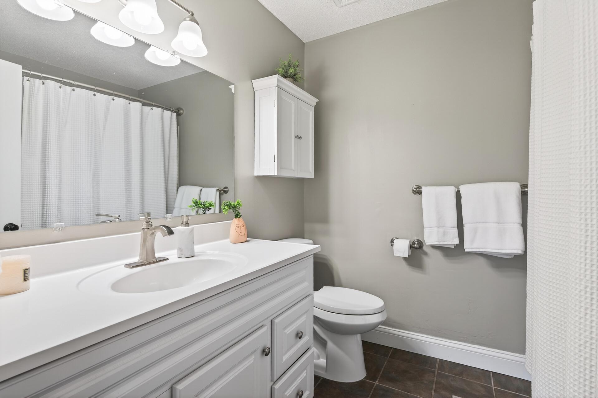 Clean, updated bathroom with modern finishes.