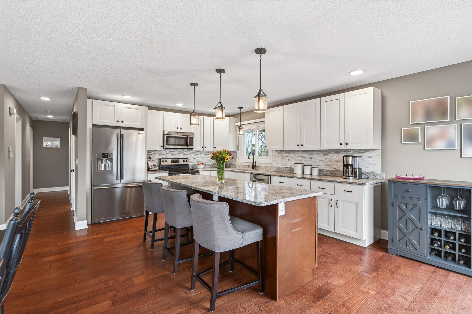 Granite countertops, stainless appliances, and an island built for entertaining.