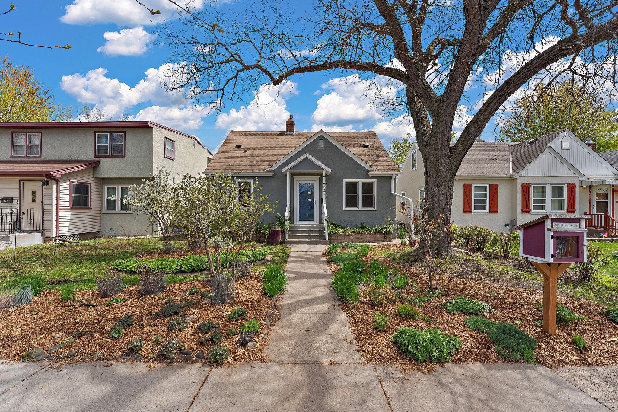 Now this is curb appeal! Organically-grown and lovingly-maintained landscaping includes well-established native and flowering perennials out front, which attract a variety of pollinators and colorful butterflies.