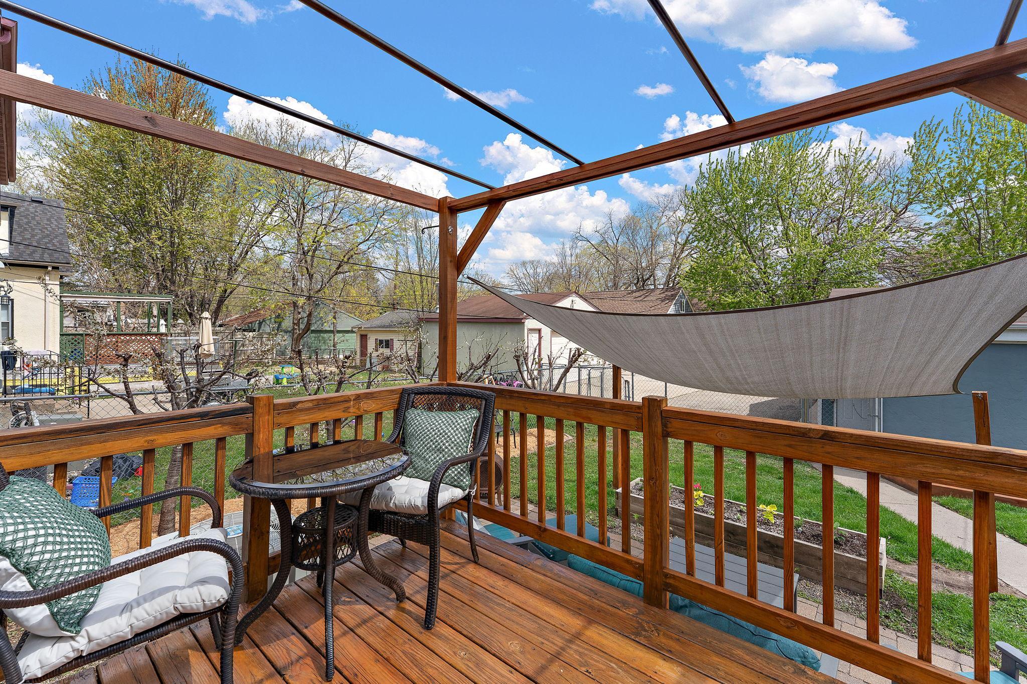 View from the deck overlooking the back yard. Enter from the sliding patio doors from the dining room.