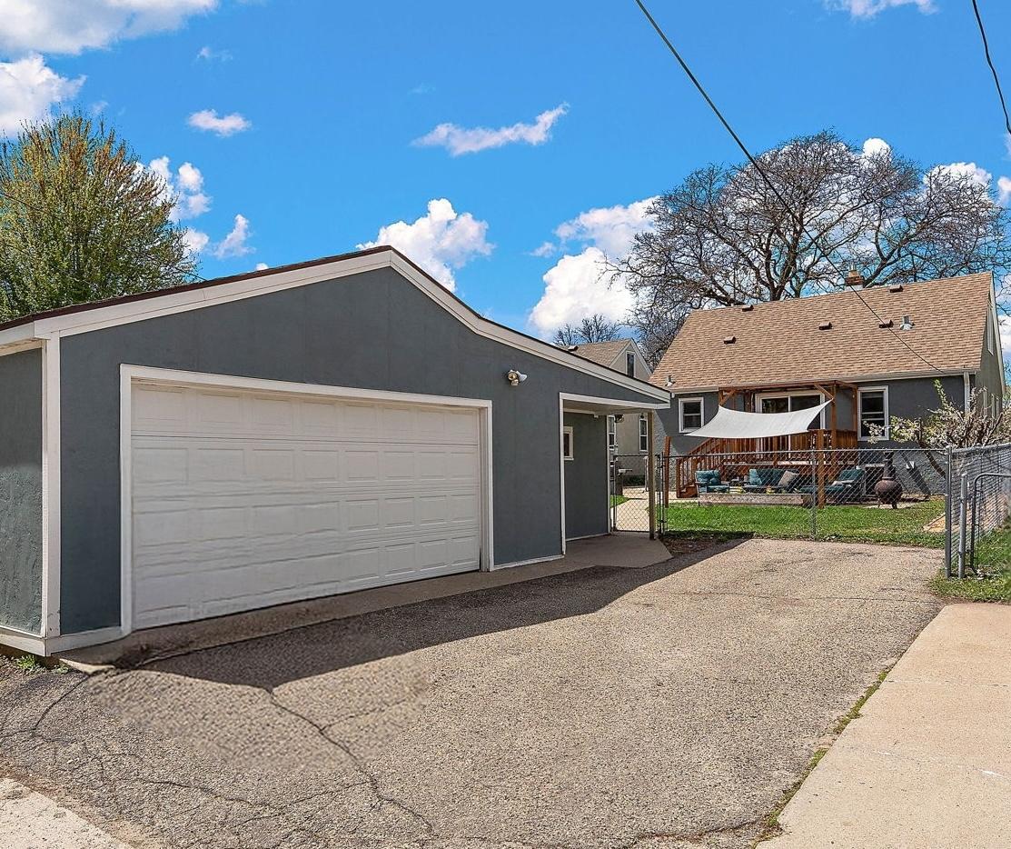 Large two-stall garage (plus 18' by 12' workshop) with extra parking space.