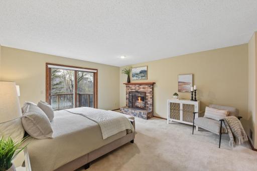 Owner's suite with wood burning fireplace