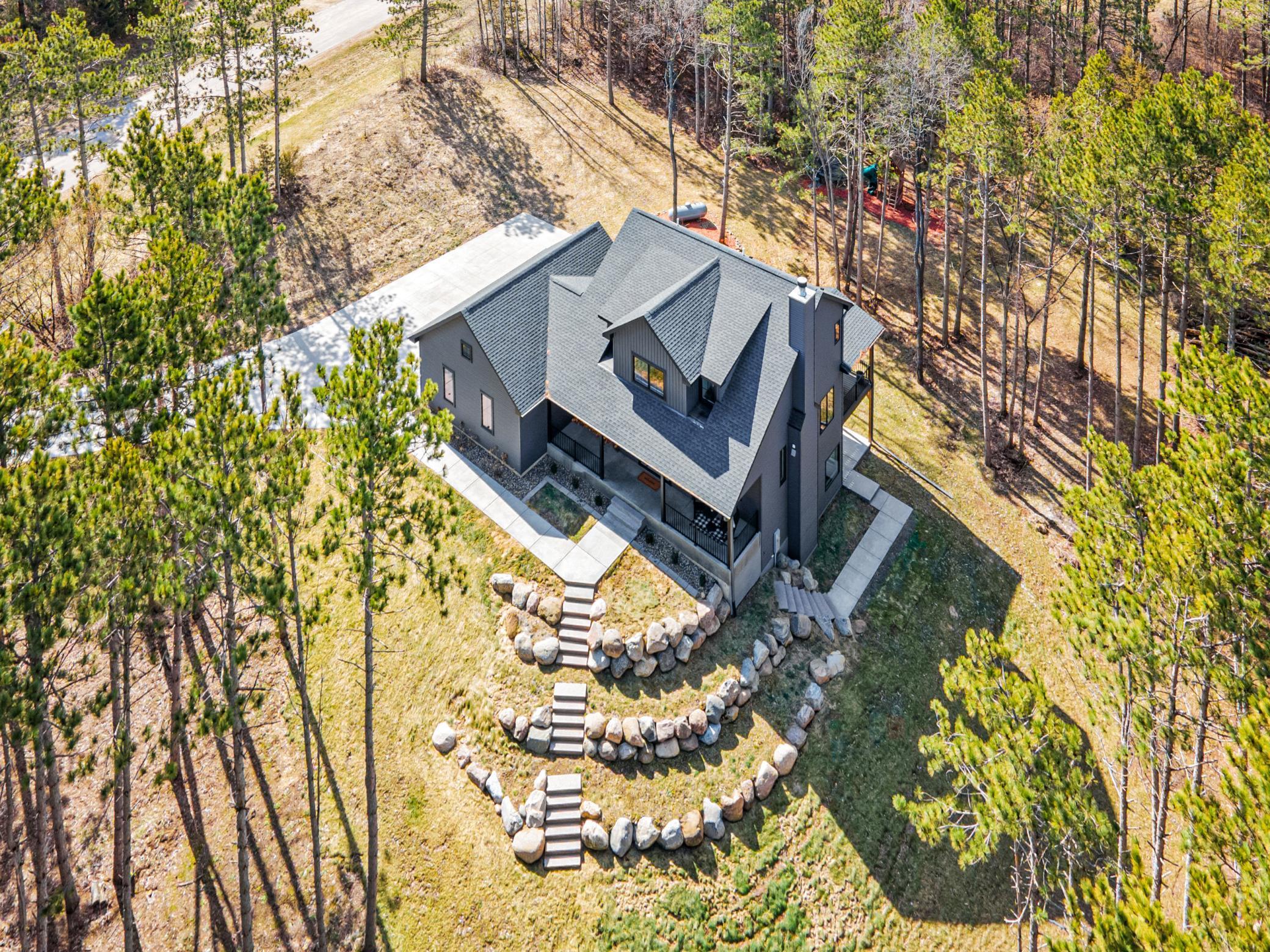 Mix of green space, walking areas, and mature trees.