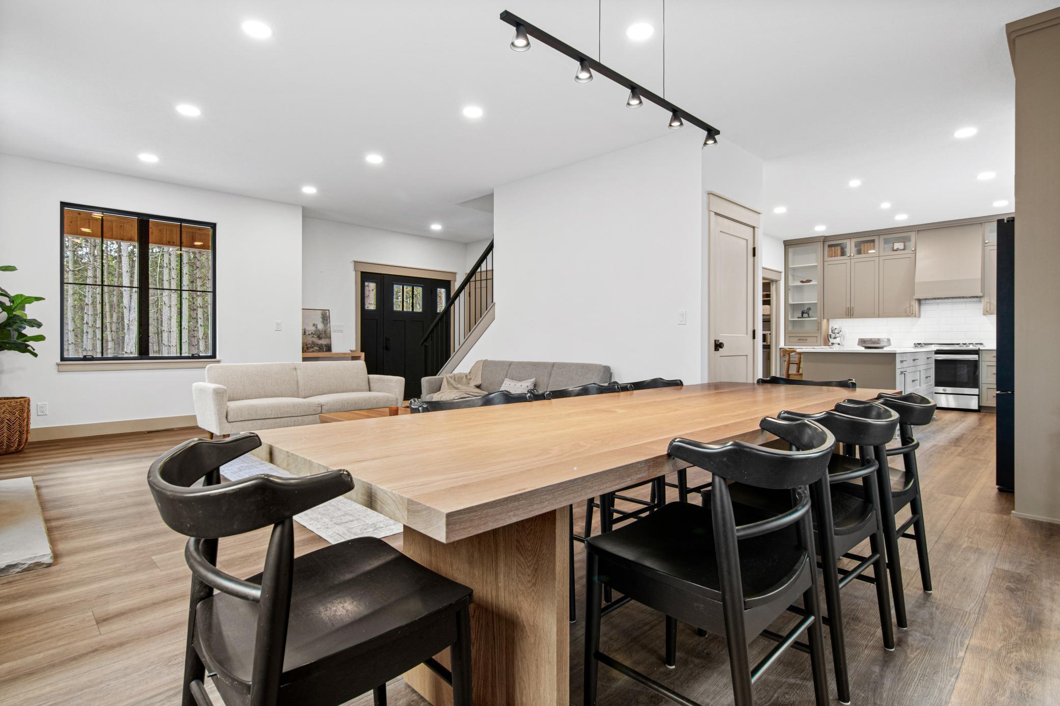 Open-concept layout connecting kitchen, dining, and living areas