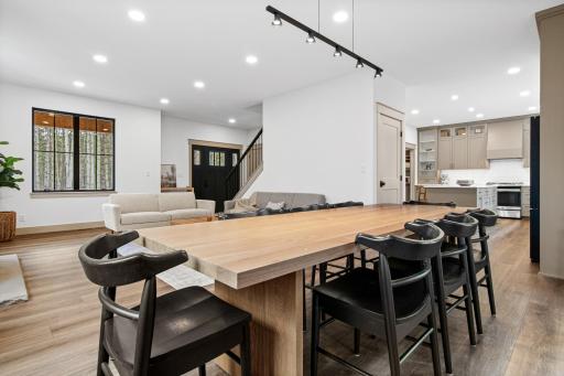 Open-concept layout connecting kitchen, dining, and living areas