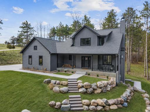This custom-built River Falls home offers a balance of modern design and natural surroundings