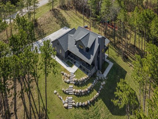 Mix of green space, walking areas, and mature trees.