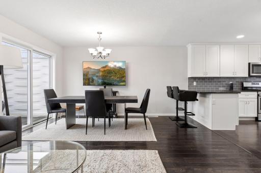 Beautiful, dark wood style plank flooring in the living/dining and kitchen.