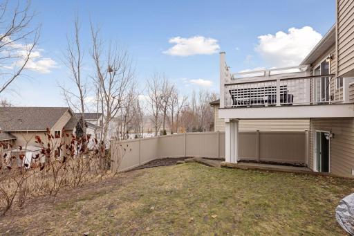 The backyard features a privacy fence on the east and west sides.