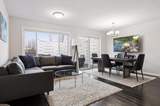 Bright and airy floor plan with walls of glass - oversized picture window and sliding patio door to the rear deck!