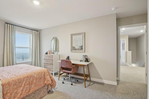 Each of the home's secondary bedrooms are spacious and filled with natural light. Photo of model, colors and options will vary.