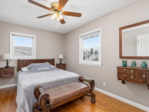 Second bedroom on main, hardwood floors and ceiling fan