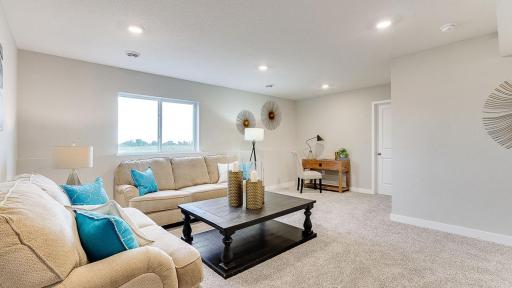This is a finished basement in a model home; shown in order to give buyer an idea of what the basement space could look like once finished. The basement shown in these photos is of a lookout basement. Home listed is a walkout and is unfinished.