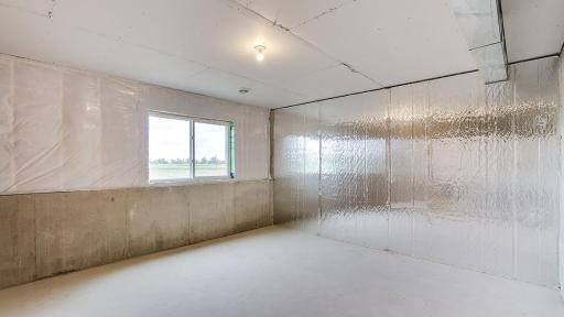Showing the unfinished space in the basement; however, the subject property is a walkout. This home shown is a lookout.