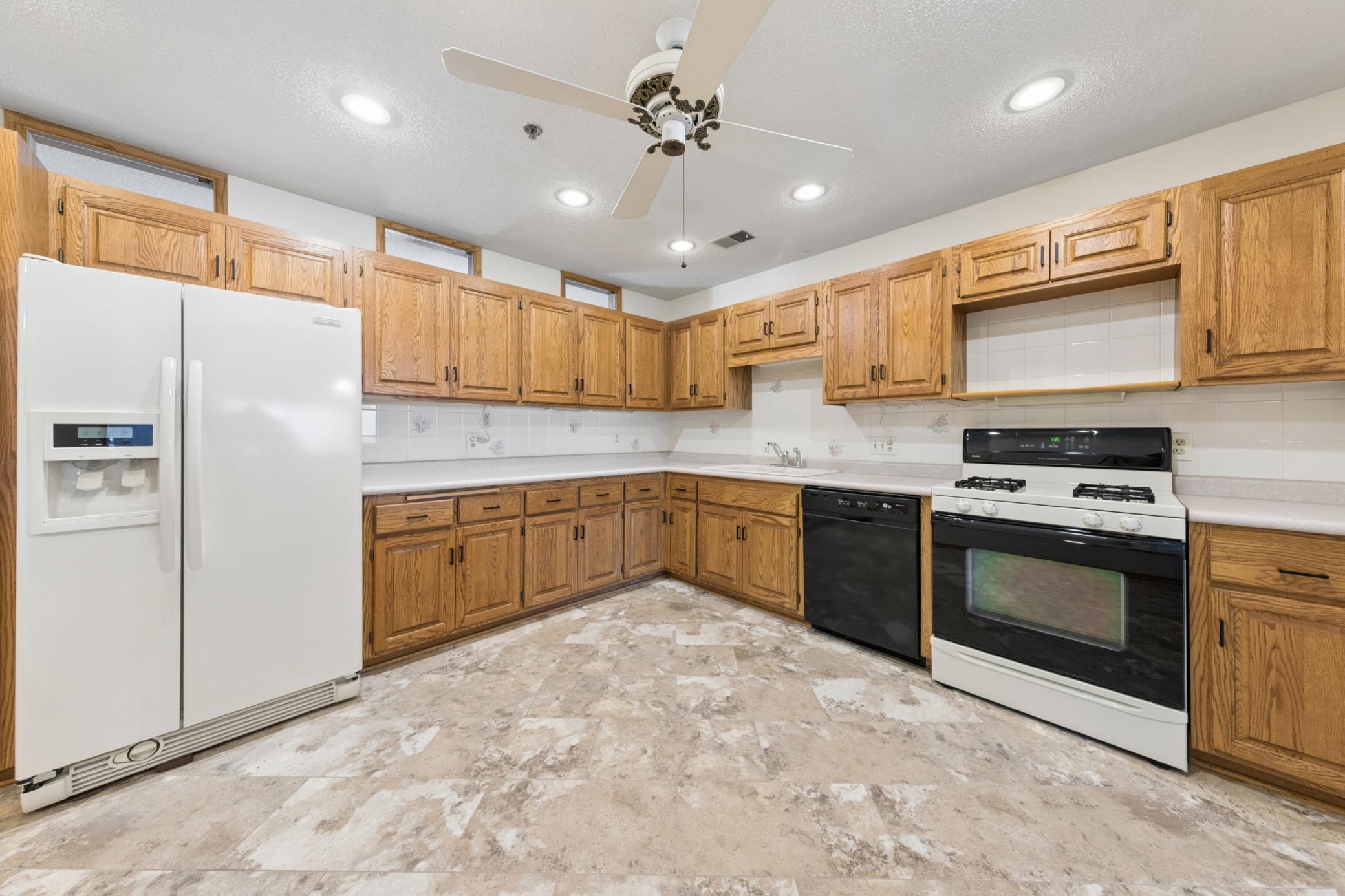 A spacious, highly functional kitchen with generous cabinetry designed for practical, everyday use.