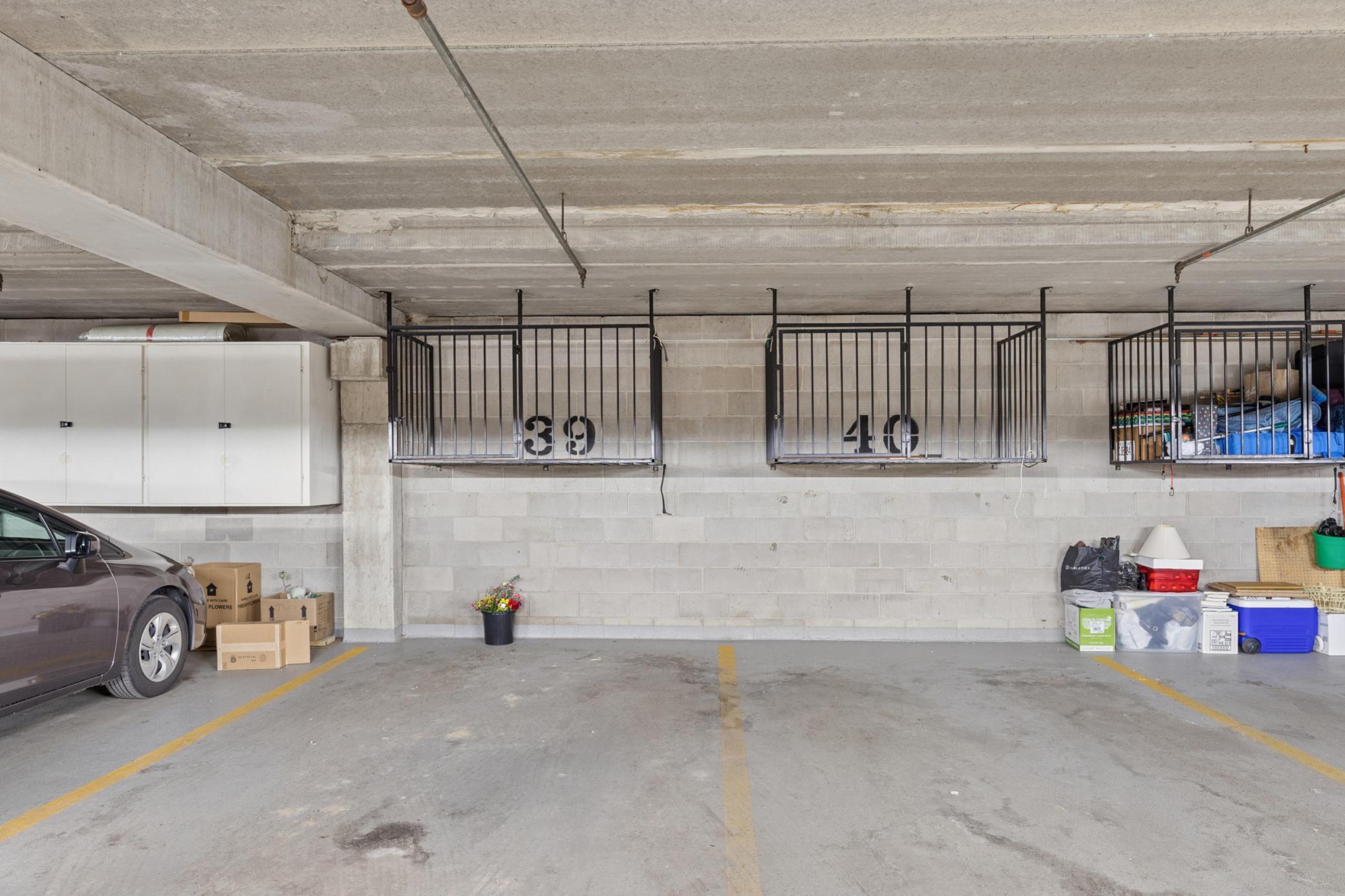 Two dedicated, heated parking spaces featuring secure overhead storage for your absolute convenience.
