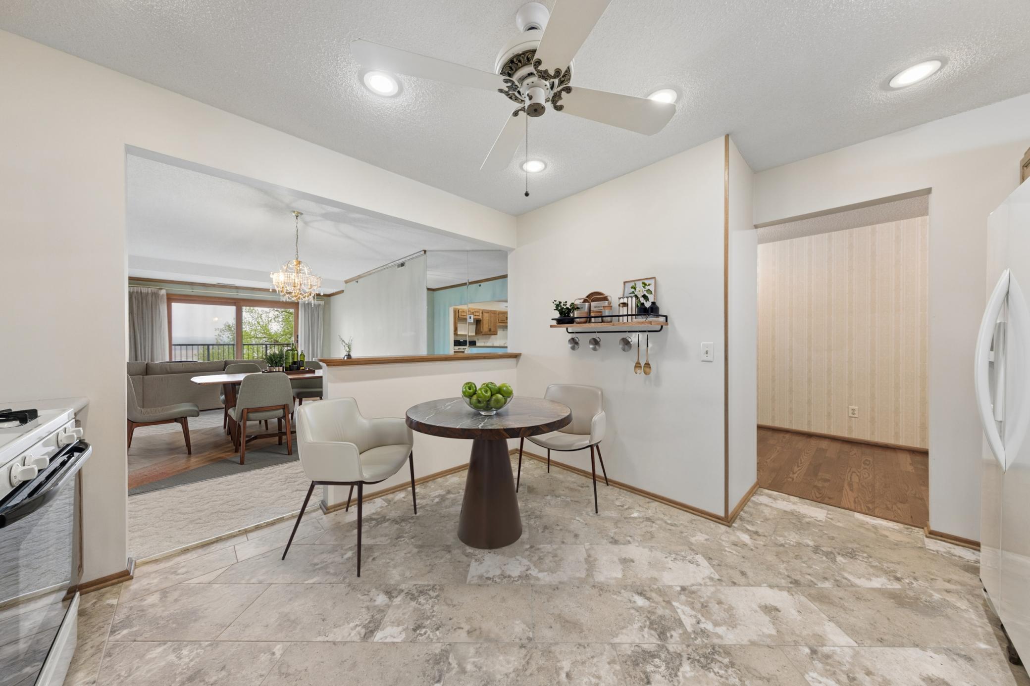 A perfectly situated dining nook that makes daily living and entertaining an effortless experience. (virtually staged)
