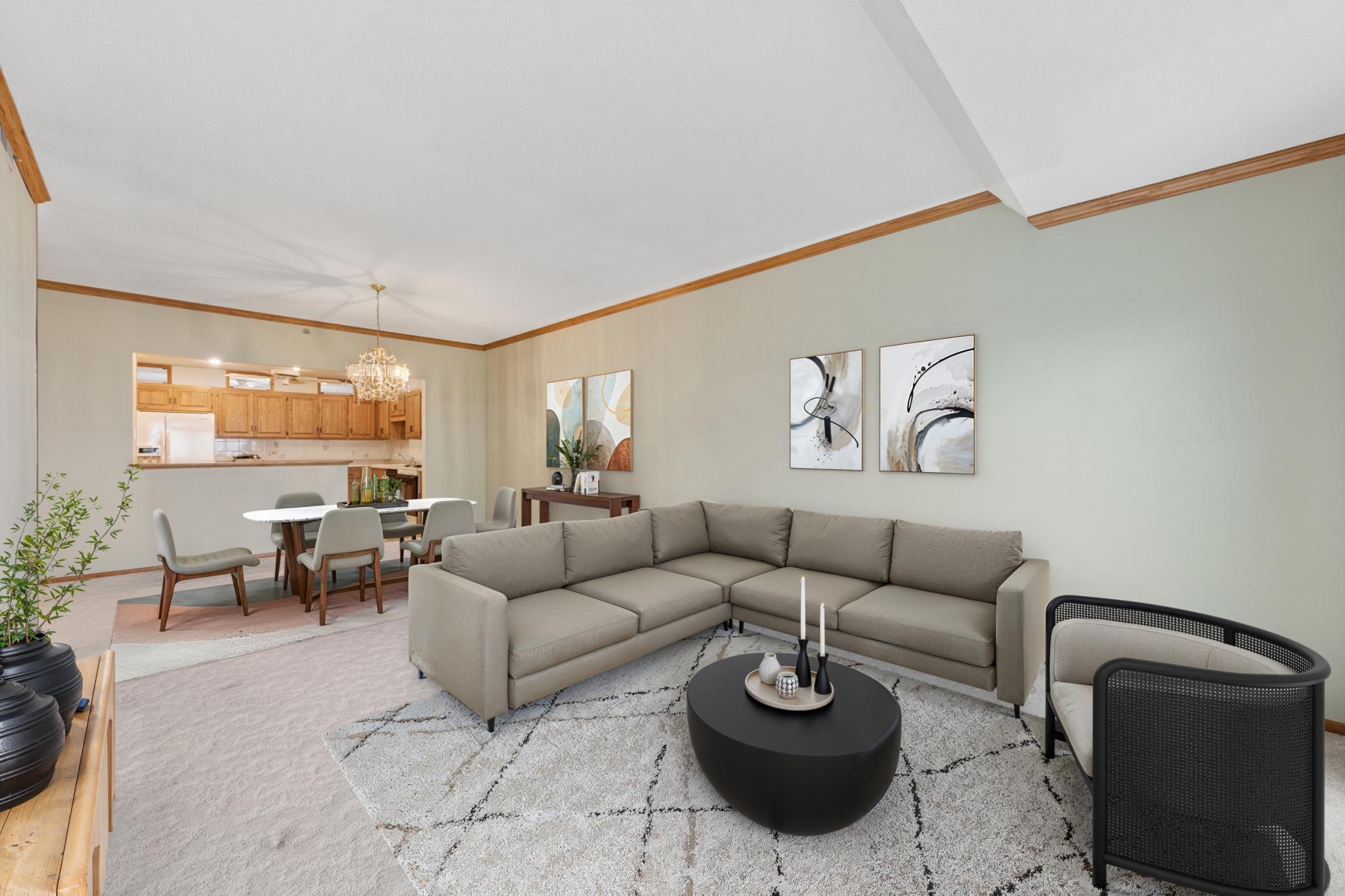 An expansive, open-concept living space providing single-family comfort without the single-family upkeep. (virtually staged)