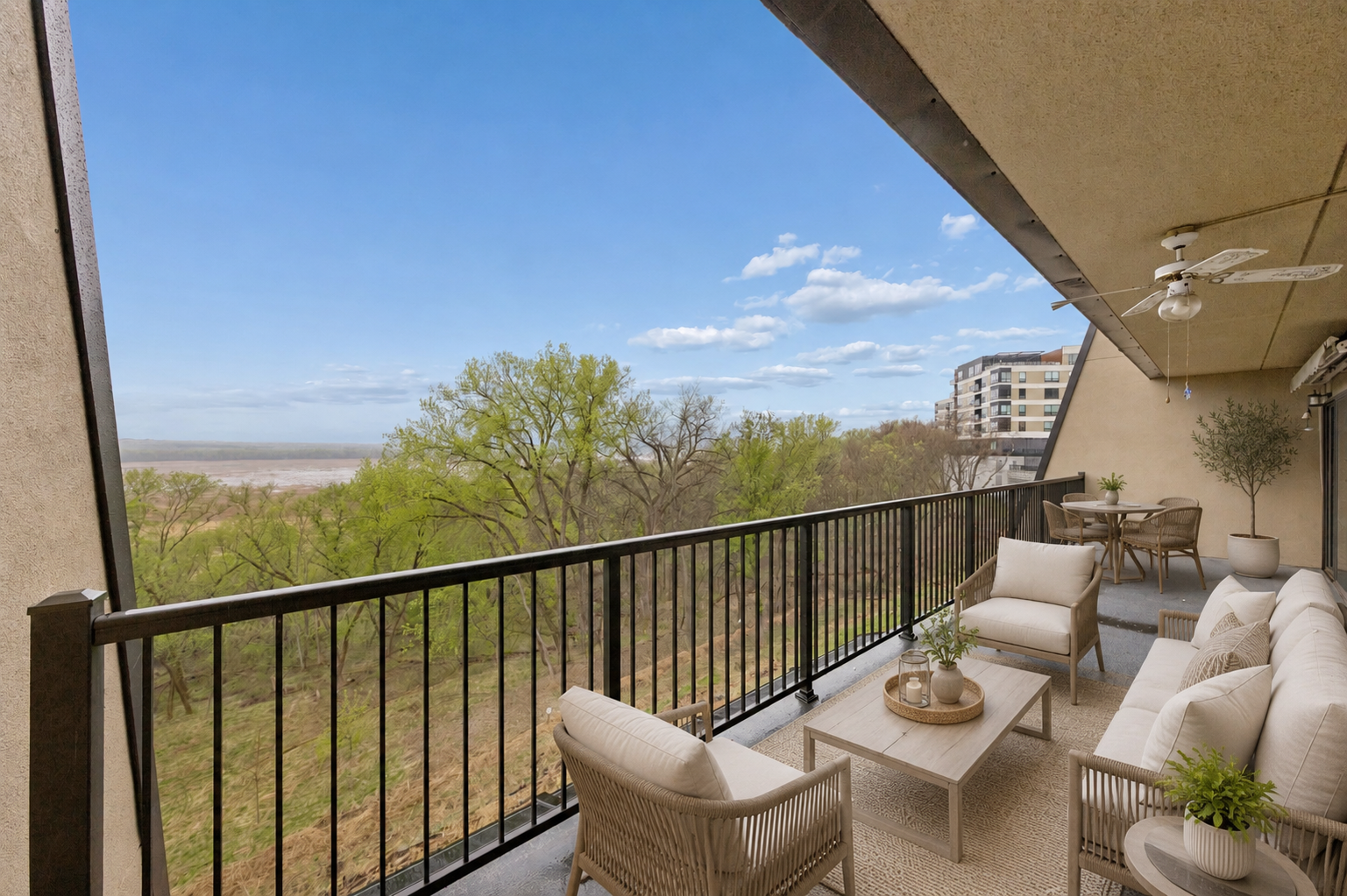 Step outside onto your expansive private balcony for an unobstructed, sweeping view of the river valley. (virtually staged)