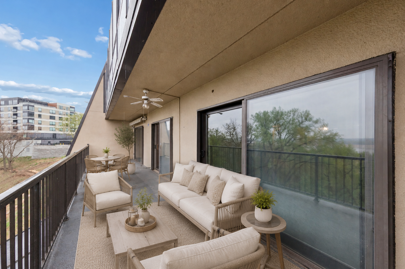 Seamlessly extend your living space outdoors with a giant balcony accessible from both the living room and bedrooms. (virtually staged)