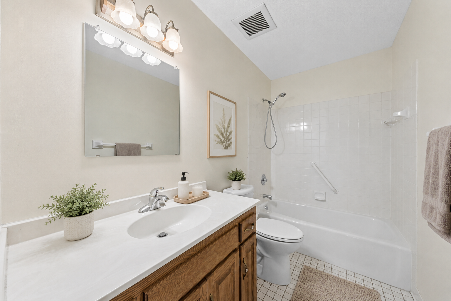 A clean, low-maintenance bathroom offering predictable comfort. (virtually staged)