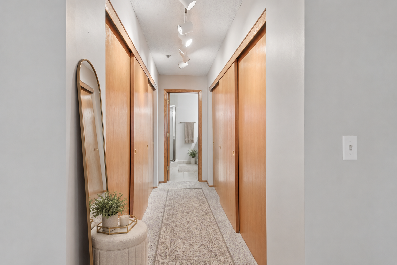 Exceptional hallway storage solutions that match the practicality and space of a single-family home. (virtually staged)
