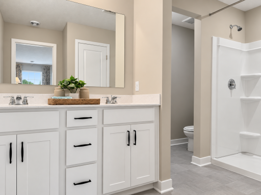 The spacious primary ensuite features dual vanities, a 5-foot shower, and a linen closet for added storage and convenien.