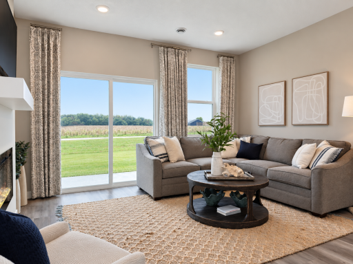 Large windows and an open layout make this living room feel bright and inviting.