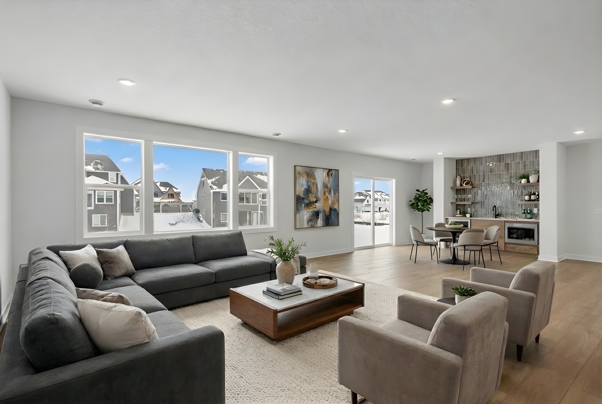 Lower level family room with wet bar *Photo is virtually staged