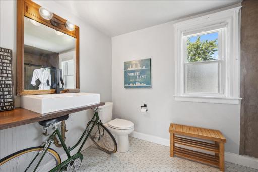 Artistic bathroom with a bike as a vanity