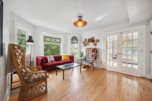 With beautiful French doors and maple floors