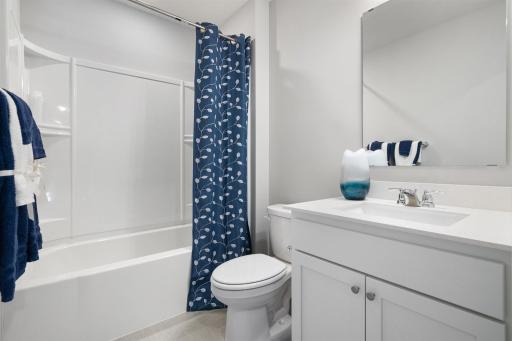 Upper level hall bath. Photo is of actual home. Colors and options may vary. Ask Sales Agent for details.