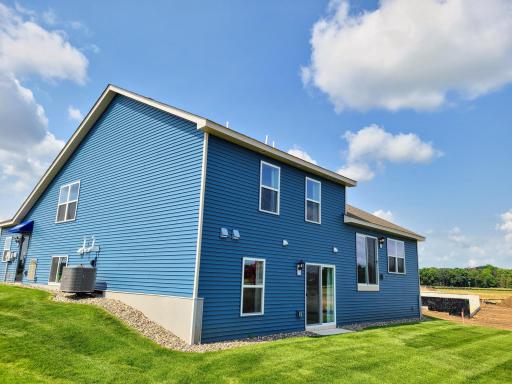 Bryant II-B Northern Craftsman rear view with Walk-out lower level at Ravine Crossing in Cottage Grove. Photo is of Model home. Options and colors may vary. Ask Sales Agent for details.
