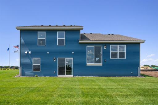 Bryant II-B Northern Craftsman rear view with Walk-out lower level at Ravine Crossing in Cottage Grove. Photo is of Model home. Options and colors may vary. Ask Sales Agent for details.